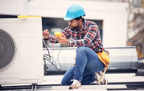 Air conditioning unit being serviced on a Toronto rooftop