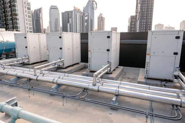Commercial HVAC rooftop unit being serviced by ZK Mechanical technician