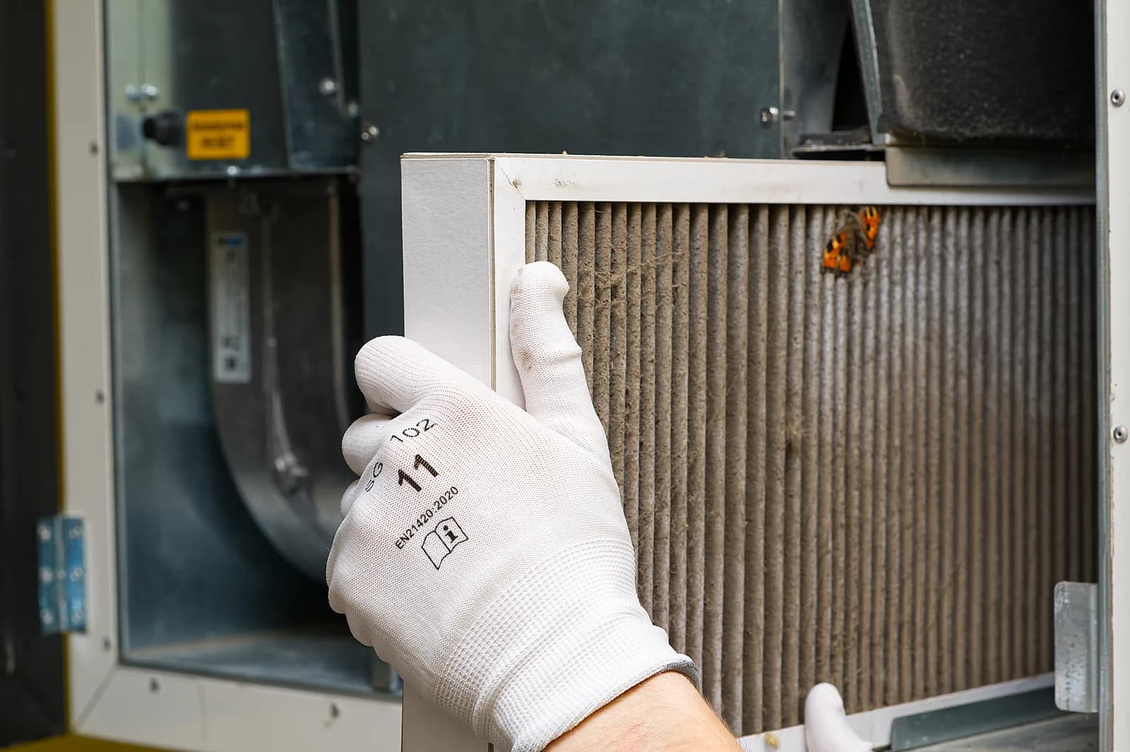 Furnace filter replaced during a seasonal HVAC maintenance visit