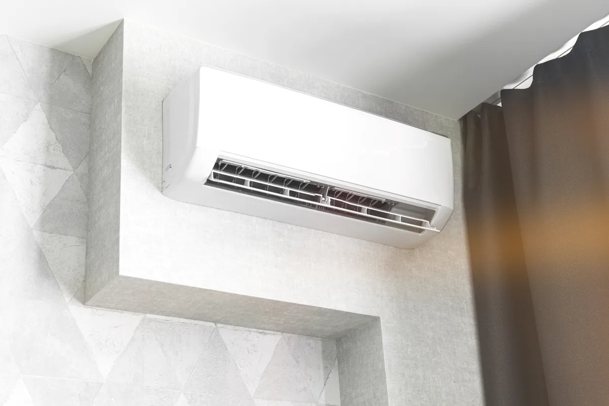 Wall-mounted ductless mini-split indoor unit installed in a modern Toronto living room