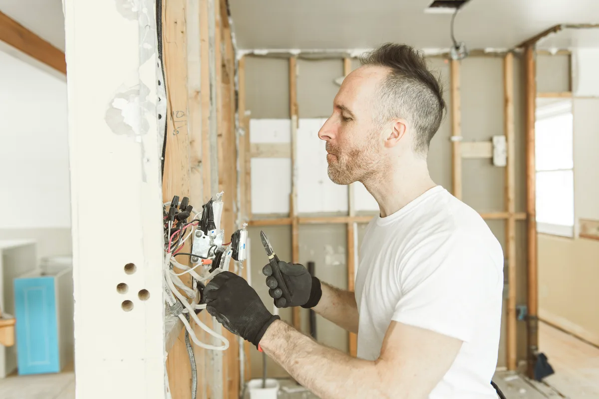 Open residential electrical panel showing breakers and the main service disconnect in a Canadian home