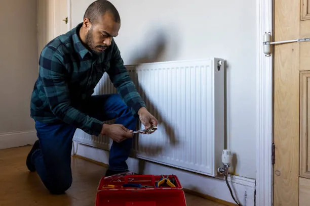 Residential radiator heating system under window