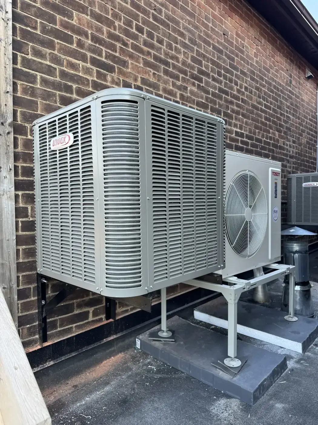 Lennox outdoor condenser units installed on elevated stands