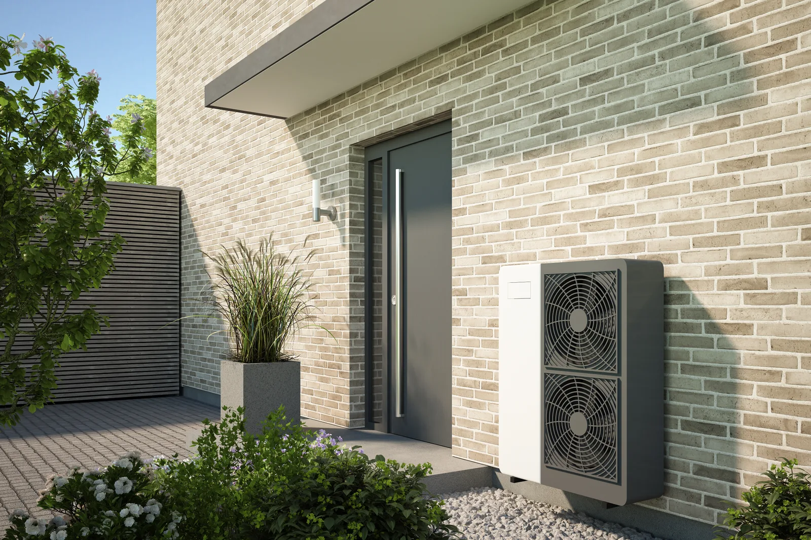 Cold-climate air-source heat pump mounted outside a modern home