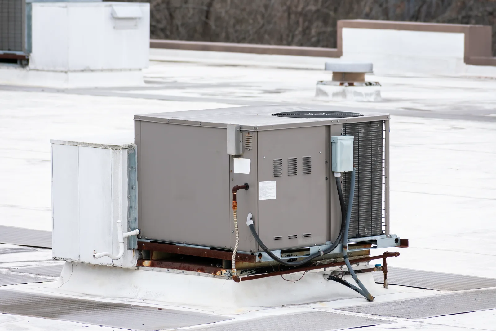 Commercial rooftop packaged HVAC unit on a flat commercial roof