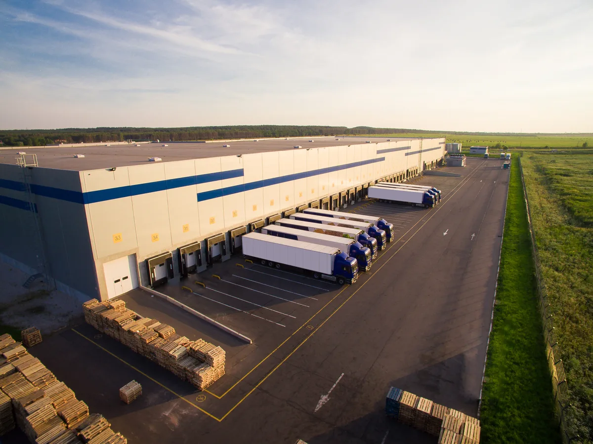 Distribution warehouse with trucks at the loading docks