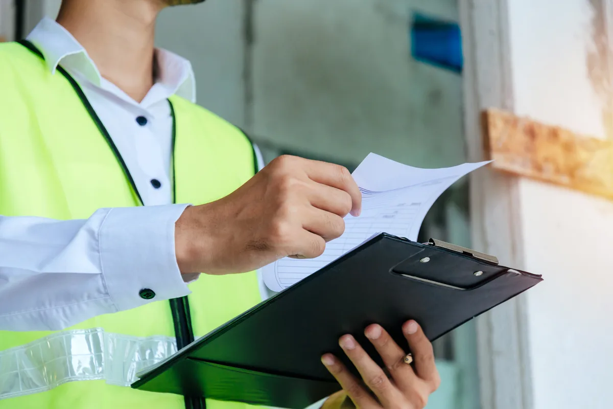 Home inspector reviewing a checklist