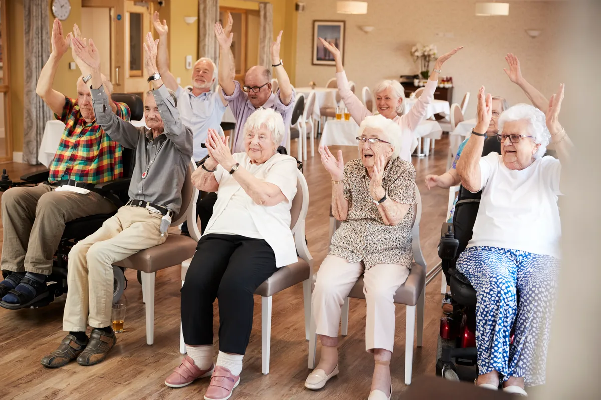 Seniors in a fitness class at a retirement home