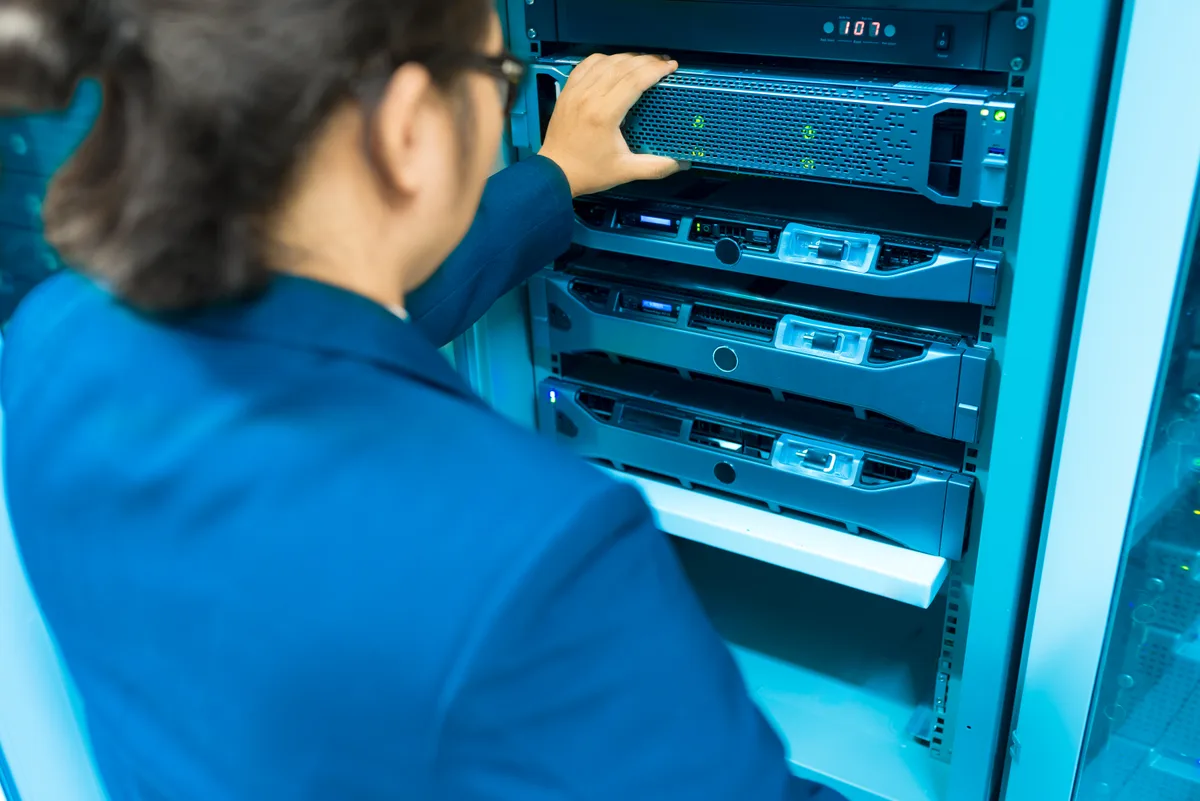 Technician working in a server room